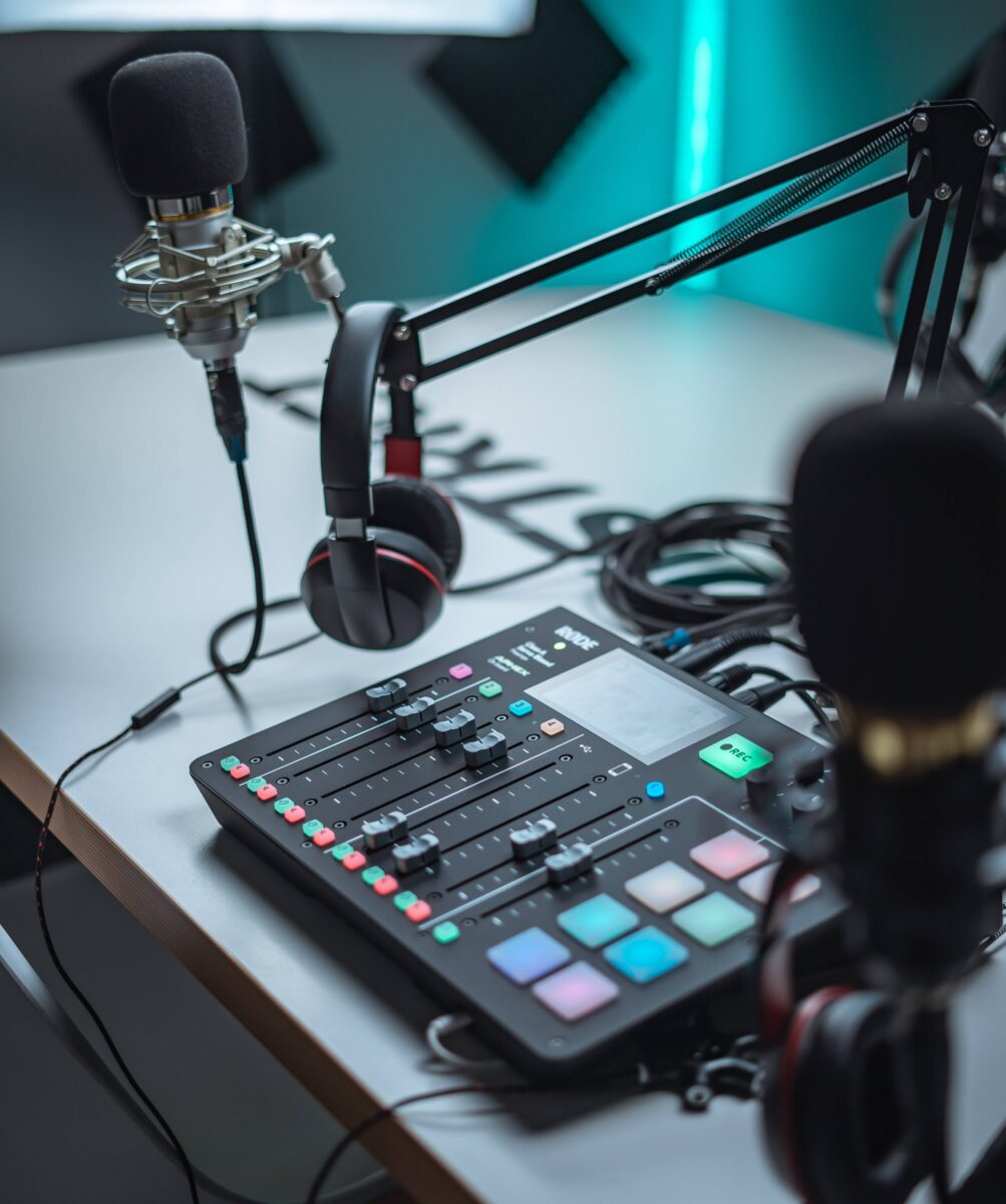 A radio station scene displaying microphones and a mixer, representing the essence of live broadcasting