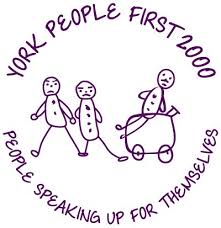 A circular logo with the text "York People First 2000" in purple. Below the text, three stick figures are walking, and one is inside a box with wheels. The logo represents the organization's focus on empowering individuals with learning disabilities.